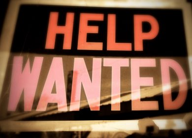 Help Wanted sign in a window