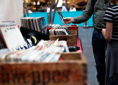 Crates of Records with two people standing near them
