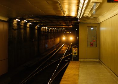 View of train coming through a tunnel