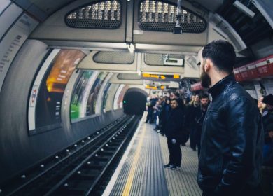 People at a platform of a train station underground