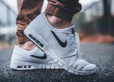 White Nike shoes on person's feet