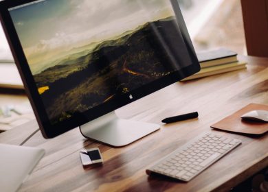 Computer on desk with phone