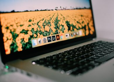 View from left Laptop with yellow flowers on the screen