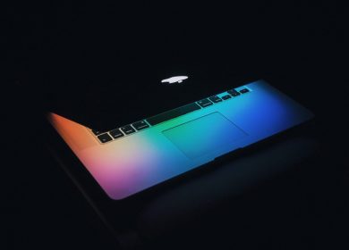 Half closed Laptop with rainbow colors showing