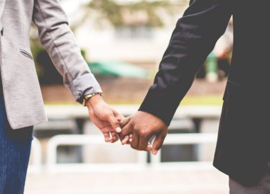 Man and woman joined by their hands holding