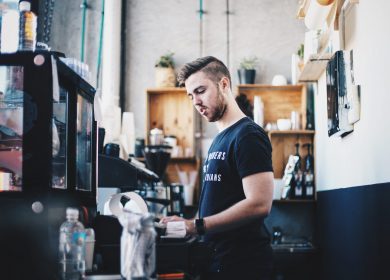 Man standing at a counter of a cafe
